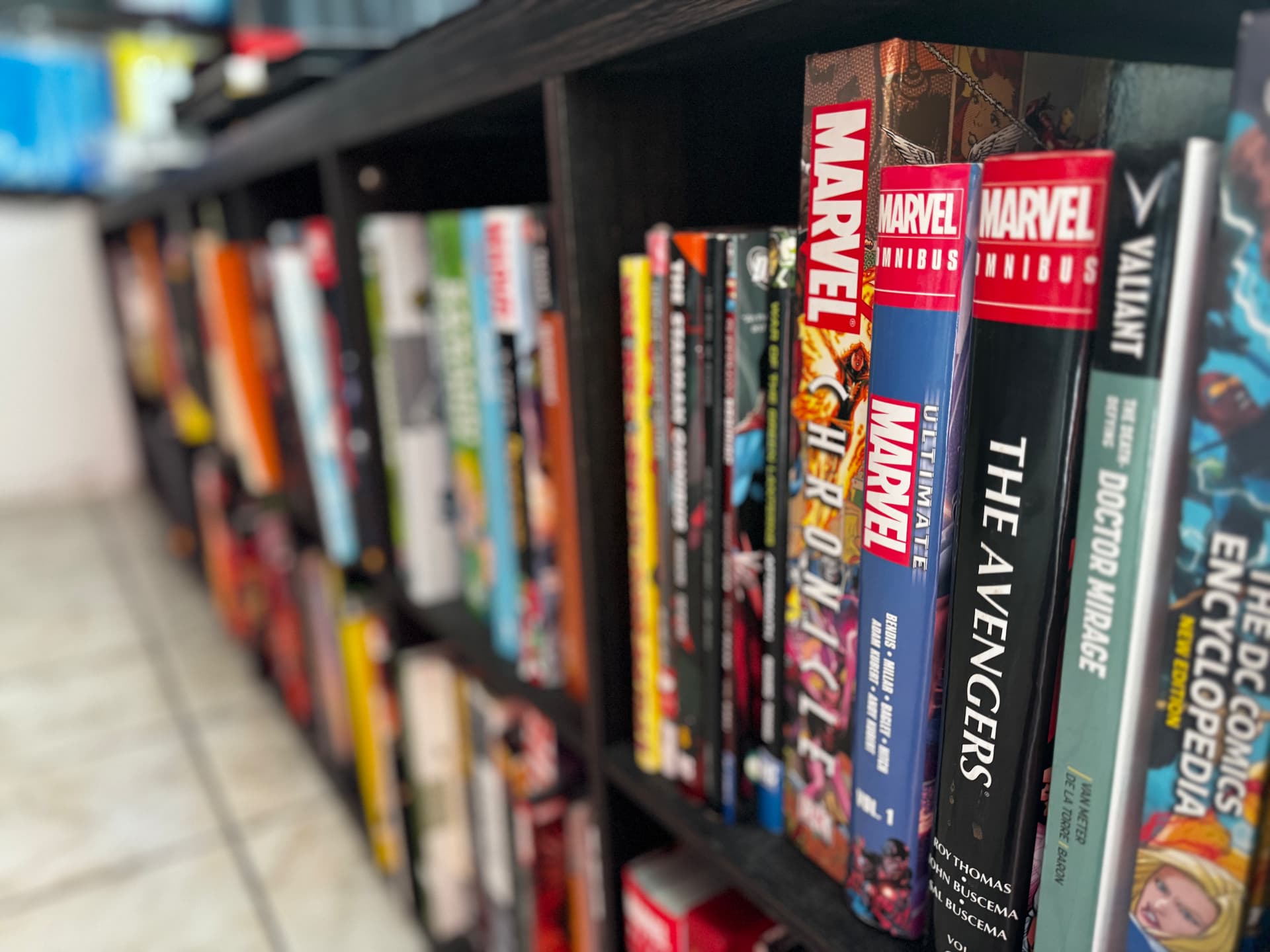 Shelves of Marvel omnibus books and graphic novels