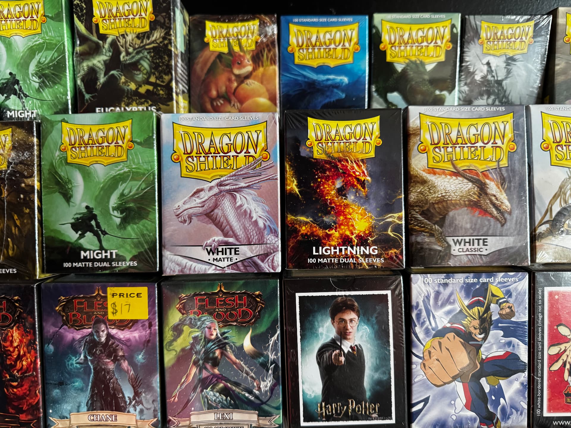 Dragon Shield card sleeves stacked on the accessory wall